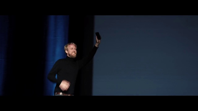 Video Reference: Arm, Standing, Performance, Elbow, Shoulder, Darkness, Joint, Photography, Public speaking, Human body