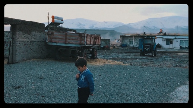 Video Reference: Mode of transport, Travel, Screenshot, Pc game, Asphalt, Digital compositing, Vehicle, Outdoor, Child, Boy, Little, Young, Small, Grass, Front, Man, Standing, Truck, Game, Girl, Playing, Street, Dirt, Beach, Blue, Holding, Woman, Flying, Field, Hill, Riding, Kite, Parked, Sky, Ground, Mountain