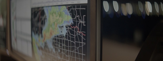 Video Reference: Wall, Art, Street art, Visual arts, Room, Glass, Window, Graphics, Indoor, Sitting, Photo, Front, Table, Computer, Black, Graffiti, Man, Board, Holding, White, Map