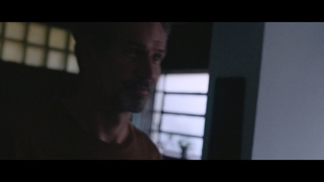 Video Reference: Black, Photograph, Face, Darkness, Facial hair, Head, Nose, Snapshot, Chin, Arm