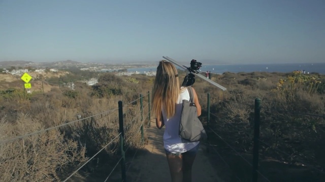 Video Reference: mountainous landforms, sky, wilderness, hill, tree, mountain, ecoregion, landscape, adventure, grass, Person