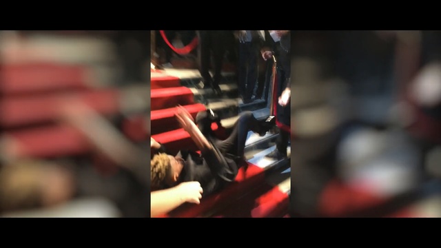 Video Reference: Red, Music, Photography, Audio equipment, Font, Room, Performance, Musician, Indoor, Photo, Sitting, Laptop, Small, Computer, Close, Using, Man, Blurry, Black, White, Woman, Phone, Screen, Table, Colorful, Holding, Laying, Food, Standing, Playing, Store, Cat, Text, Person, Colored