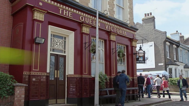 Video Reference: town, neighbourhood, building, city, facade, street, house, Person