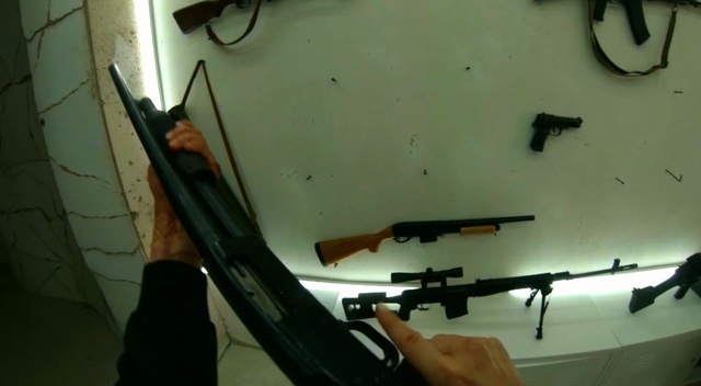 Video Reference: Firearm, Gun, Rifle, Air gun, Trigger, Airsoft gun, Ranged weapon, Airsoft, Assault rifle, Gun barrel, Person, Thing, Weapon, Indoor, Hanging, Mirror, White, Large, Table, Dirty, Sink, Wall, Shotgun, Handgun, Shooting, Machine gun, Tool, Tripod, Sniper rifle
