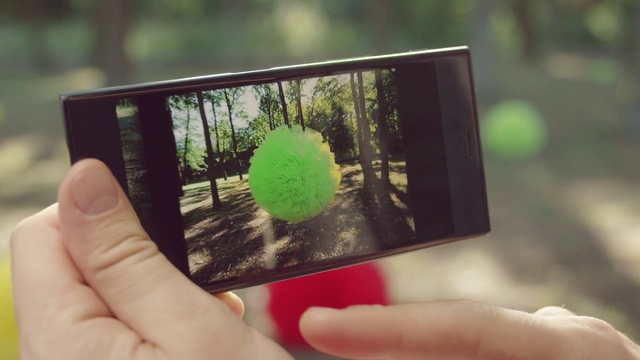 Video Reference: Green, Hand, Finger, Tree, Gadget, Thumb, Technology, Electronic device, Plant, Portable communications device, Person, Table, Holding, Small, Computer, Front, Keyboard, Man, Using, Food, Laptop, Close, White, Mirror, Woman, Screen, Pizza, Young, Glass, Phone, Bird, Plate, Text