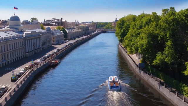 Video Reference: waterway, canal, body of water, water transportation, river, channel, city, bank, water resources, sky