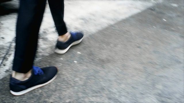 Video Reference: footwear, shoe, photograph, leg, floor, sneakers, outdoor shoe, flooring, foot, asphalt