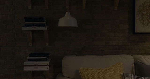 Video Reference: Room, Light, Furniture, Lighting, Wall, Interior design, Table, Floor, Hardwood, Design, Person