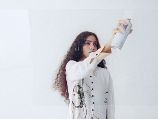 Video Reference: White, Arm, Fashion, Shoulder, Long hair, Outerwear, Sleeve, Photo shoot, Photography, Neck