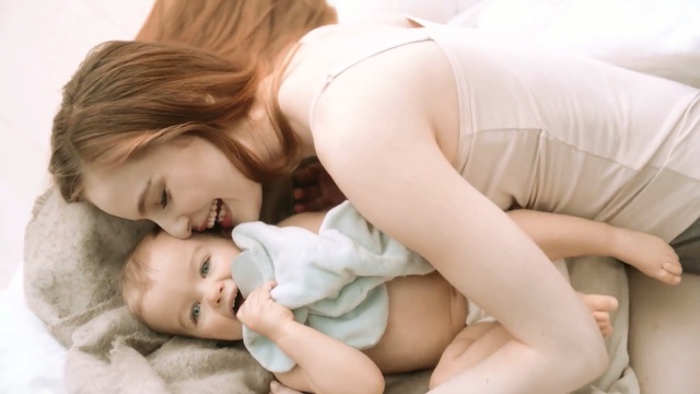 Video Reference: bed, child, love, parent, mother, baby, lying, bedroom