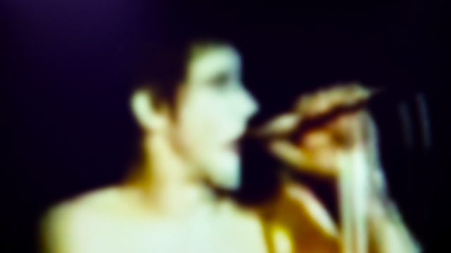 Video Reference: singing, yellow, singer, darkness, pop music, performance, music, mouth, hand, performance art