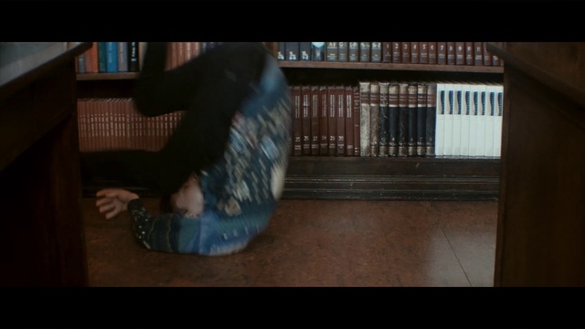 Video Reference: Floor, Photograph, Flooring, Hardwood, Head, Snapshot, Wood, Sitting, Fun, Leg, Person, Indoor, Table, Building, Man, Small, Computer, Laptop, Woman, Bench, Room, Wooden, Holding, Young, White, Standing, Cat, Kitchen, Luggage