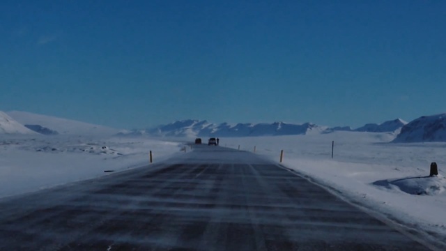 Video Reference: sky, arctic, mountain range, road, glacial landform, atmosphere, snow, freezing, ice cap, ice
