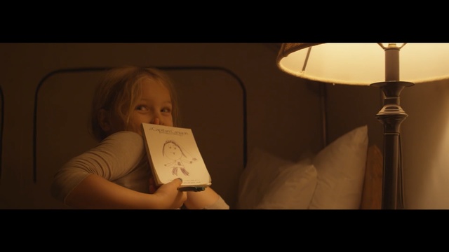 Video Reference: light, girl, lighting, darkness, sitting, human, lamp, lighting accessory, fun, scene, Person