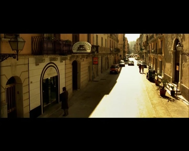 Video Reference: Photograph, Town, Landmark, Street, Arch, Snapshot, Architecture, Road, Lighting, Neighbourhood, Person