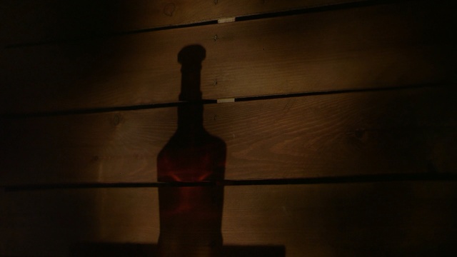 Video Reference: light, darkness, bottle, lighting, shadow, reflection, glass bottle, glass, wood, light fixture