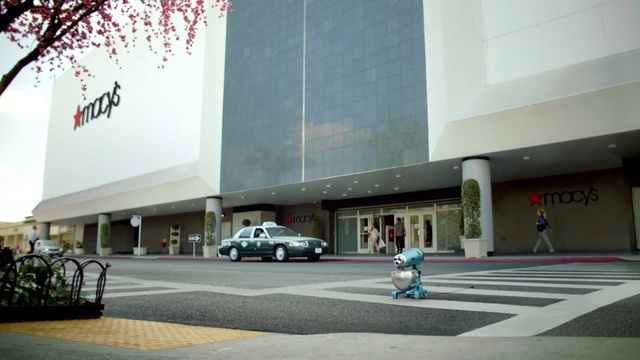 Video Reference: Architecture, Building, Metropolitan area, Street, City, Facade, Road, Commercial building, Vehicle, Car