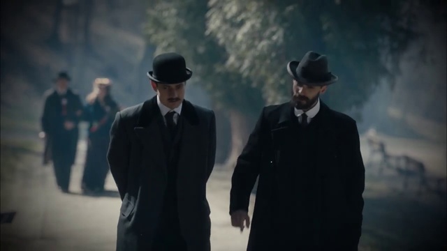 Video Reference: Gentleman, Standing, Male, Suit, Photography, Movie, Screenshot, Formal wear, Fictional character, Darkness