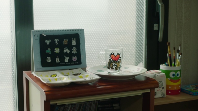 Video Reference: Room, Green, Furniture, Table, Desk, House, Home, Microwave oven, Interior design, Electronics