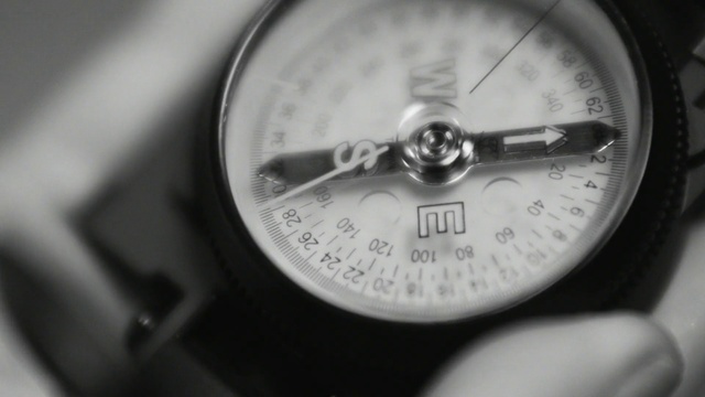 Video Reference: Gauge, Compass, Black-and-white, Photography, Close-up, Measuring instrument, Auto part, Monochrome photography, Monochrome, Tool, Thing, Clock, Indoor, Black, Small, Sitting, Hand, Close, Time, White, Mirror, Laying, Teeth, Watch, Device, Analog watch, Silver
