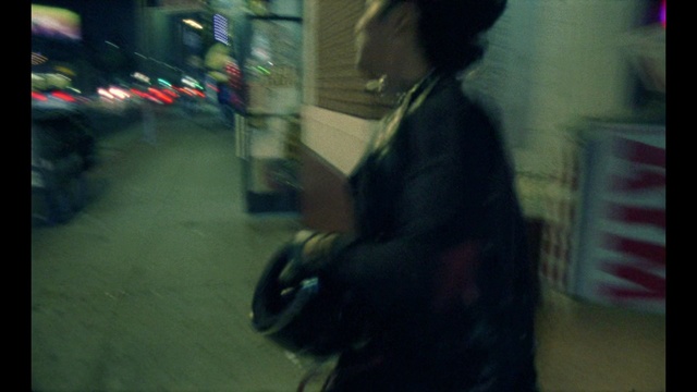 Video Reference: Black, Photograph, Light, Snapshot, Mode of transport, Street, Night, Darkness, Human, Photography, Person, Indoor, Man, Front, Looking, Holding, Woman, Blurry, Cellphone, Standing, Phone, Television, Dark, Sitting, Cat, Screen, Young, Mirror, Monitor, Room, Reflection, Computer, Remote, Video, Food, Red, Playing, Table, White, Blur