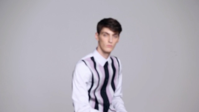 Video Reference: White, Clothing, Photograph, Dress shirt, Shirt, Standing, Shoulder, Gentleman, Outerwear, Male, Person