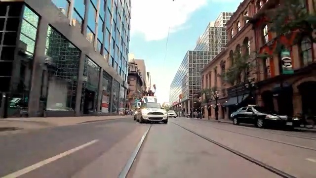 Video Reference: car, land vehicle, lane, road, transport, neighbourhood, street, urban area, metropolis, metropolitan area