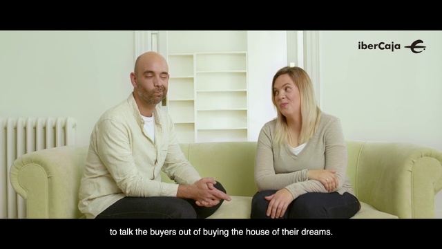 Video Reference: Sitting, Conversation, Blond, Interaction, Hand, Photo caption, Gesture, Neck, Happy, Comfort, Person, Indoor, Woman, Window, Man, Looking, Smiling, Holding, Television, Young, Computer, White, Black, People, Laptop, Room, Wii, Video, Table, Remote, Standing, Bed, Text, Human face, Screenshot, Clothing, Smile