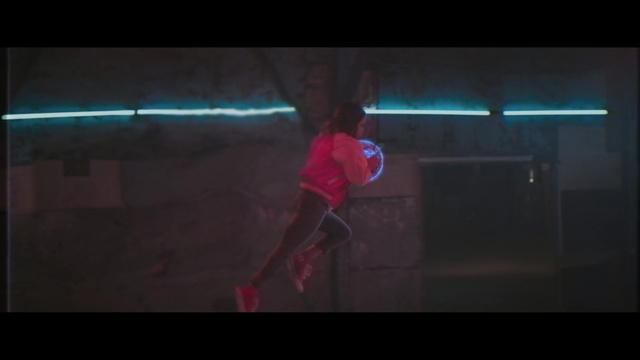 Video Reference: red, blue, black, darkness, mode of transport, light, event, aerialist, entertainment, performance