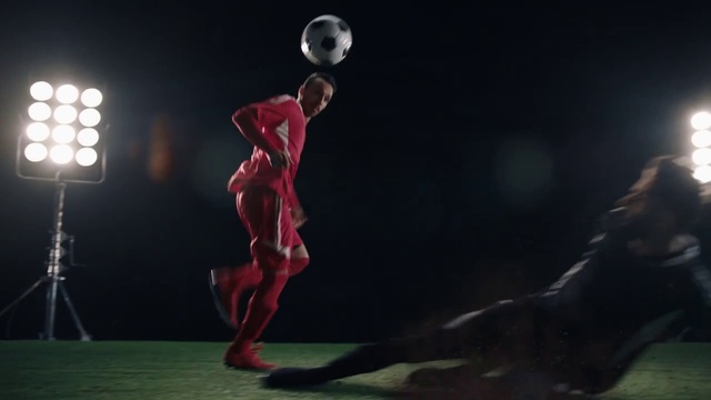 Video Reference: Red, Football player, Fictional character, Performance art, Performance, Football, Ball, Competition event, Player, Superhero