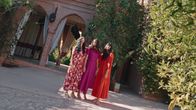 Video Reference: Maroon, Tradition, Outerwear, Dress, Temple, Leisure, Magenta, Formal wear