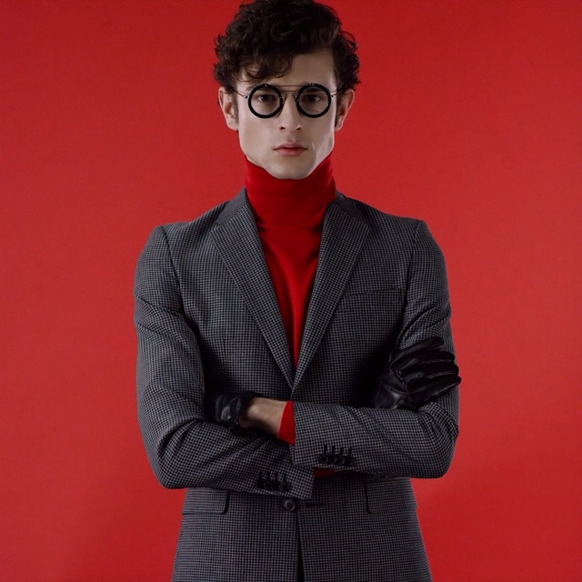 Video Reference: suit, blazer, eyewear, formal wear, vision care, plaid, gentleman, outerwear, fashion, tartan, Person