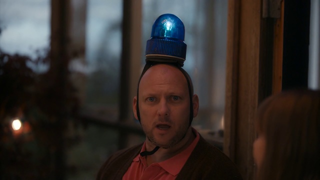 Video Reference: Human, Headgear, Temple, Screenshot, Vacation, Person, Man, Wearing, Looking, Standing, Holding, Front, Hat, Sitting, Shirt, Table, Food, Cake, Young, Red, Pizza, White, Blue, Street, Phone, Human face, Clothing