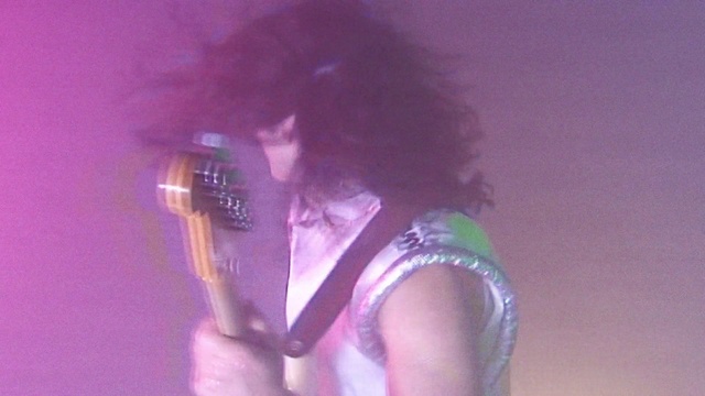 Video Reference: Purple, Performance, Microphone, Singer, Singing, Music artist, Magenta, Black hair, Performing arts, Musician