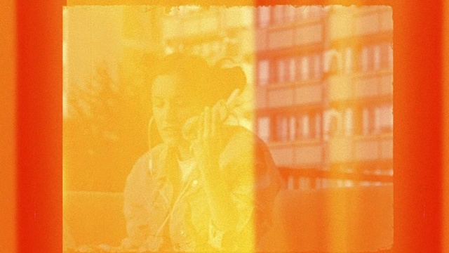 Video Reference: Orange, Yellow, Red, Font, Modern art, Tints and shades, Art, Pattern, Illustration, Rectangle, Person