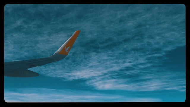 Video Reference: Sky, Blue, Air travel, Airline, Airplane, Atmosphere, Fin, Cloud, Airliner, Flight, Outdoor, Surfing, Water, Plane, Large, Flying, Wave, Clouds, Cloudy, Board, Orange, Ocean, Jet, Monitor, Air, Man, White, Yellow, Riding, Red, Skiing, Ball, Boat, Beach, Aircraft, Water sport, Text
