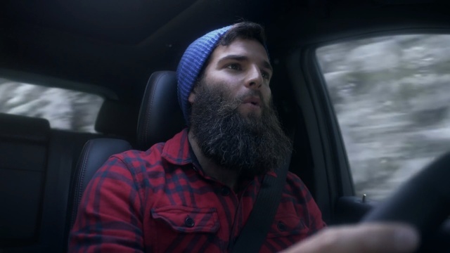 Video Reference: hair, facial hair, beard, car, driving, fun, vehicle, city car, Person