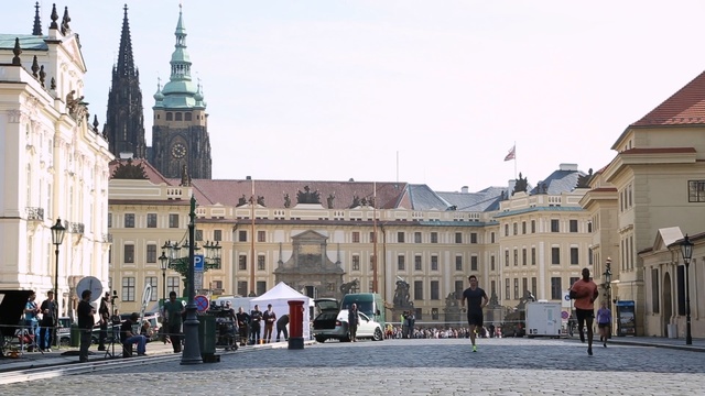 Video Reference: town square, town, city, plaza, public space, urban area, building, neighbourhood, palace, street, Person