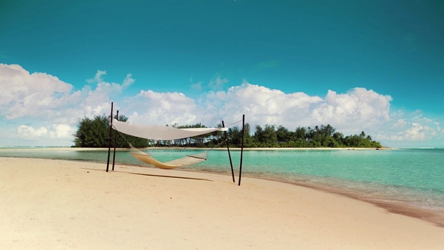 Video Reference: volleyball net, net, beach, game equipment, sand, sea, ocean, equipment, water, vacation, travel, island, coast, tropical, sky, landscape, shore, summer, paradise, tourism, holiday, coastline, wave, palm, relax, resort, Person