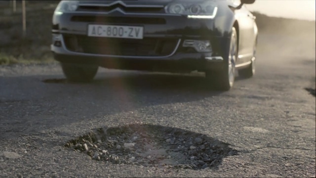 Video Reference: car, motor vehicle, asphalt, vehicle, vehicle door, road, mode of transport, mid size car, family car, luxury vehicle