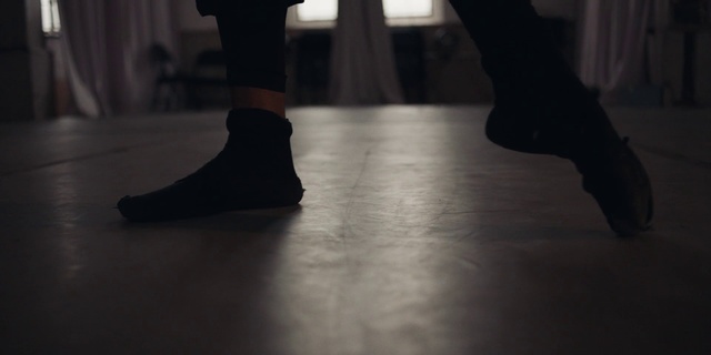 Video Reference: Footwear, Black, Human leg, Shoe, Leg, Ankle, Floor, Joint, Brown, Dance