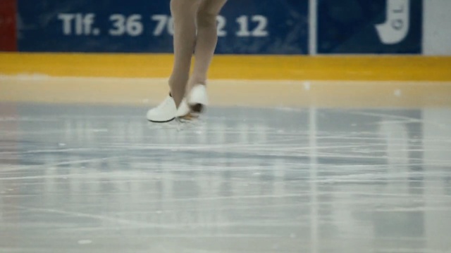 Video Reference: skating, ice skating, sport venue, figure skate, sports, figure skating, recreation, floor, winter sport, player