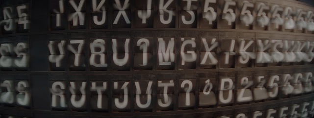 Video Reference: Font, Text, Vehicle registration plate, Number, Automotive exterior, Photography, Auto part, Wood, Signage, Pattern, Person, Black, Large, Sitting, Food, Sign, Street, White, Man, Clock, Blue, People, Screenshot, Typography