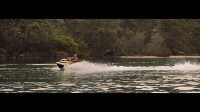 Video Reference: Sports, Water sport, Personal water craft, Surface water sports, Water transportation, Outdoor recreation, Boating, Jet ski, Recreation, Towed water sport, Water, Outdoor, Person, Boat, Man, Riding, Body, Lake, Board, Holding, Air, Surfing, Ocean, Wave, Flying, Kite, Large, Jet, Yellow, Doing, Skiing, White, River, Train, Beach, Watercraft, Paddle, Canoe, Waterskiing, Sports equipment, Vehicle, Kayak