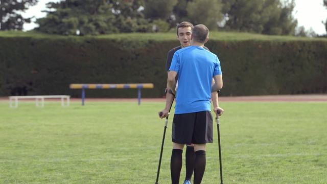 Video Reference: player, football player, sports, team sport, games, grass, ball game, sports training, sport venue, ball, Person