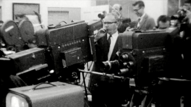 Video Reference: black and white, musical instrument accessory, car, cinematographer, technology, vehicle, Person