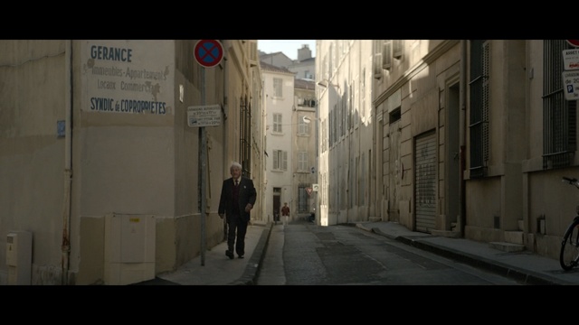 Video Reference: Alley, Street, Road, Photograph, Town, Neighbourhood, Lane, Pedestrian, Mode of transport, Urban area, Person