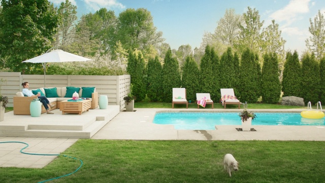 Video Reference: swimming pool, property, backyard, leisure, yard, grass, estate, outdoor furniture, lawn, home, Person