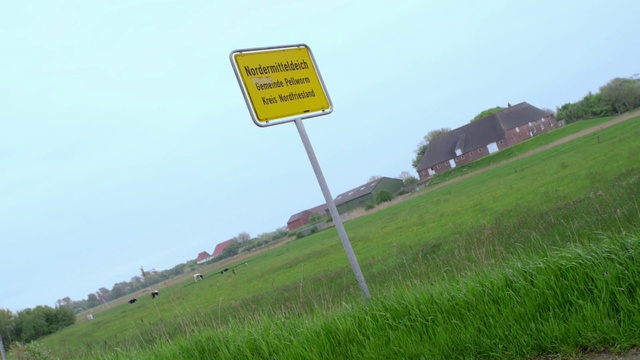 Video Reference: Grassland, Land lot, Road, Field, Pasture, Sign, Signage, Natural environment, Grass, Prairie