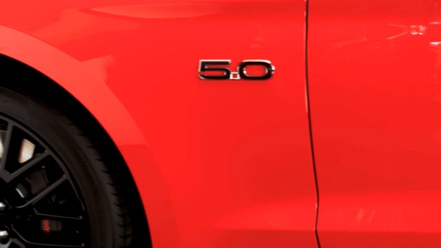 Video Reference: car, motor vehicle, red, automotive design, yellow, vehicle, orange, automotive lighting, light, luxury vehicle